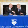 Bucks County Community College President and CEO Patrick M. Jones (left) and Temple President John Fry (right) sign a new Honors-to-Honors Agreement, strengthening the partnership between the two ...