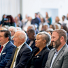 Christopher Barnett, CLA '10, seated with University Trustee Tiffany Wilson, and Mitch Morgan, chair of the Temple Board of Trustees, at the Paley Hall opening ceremony