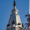 Three side by side photos of the colosseum in Rome, Italy; Philadelphia, PA city hall; and a temple in Tokyo, Japan